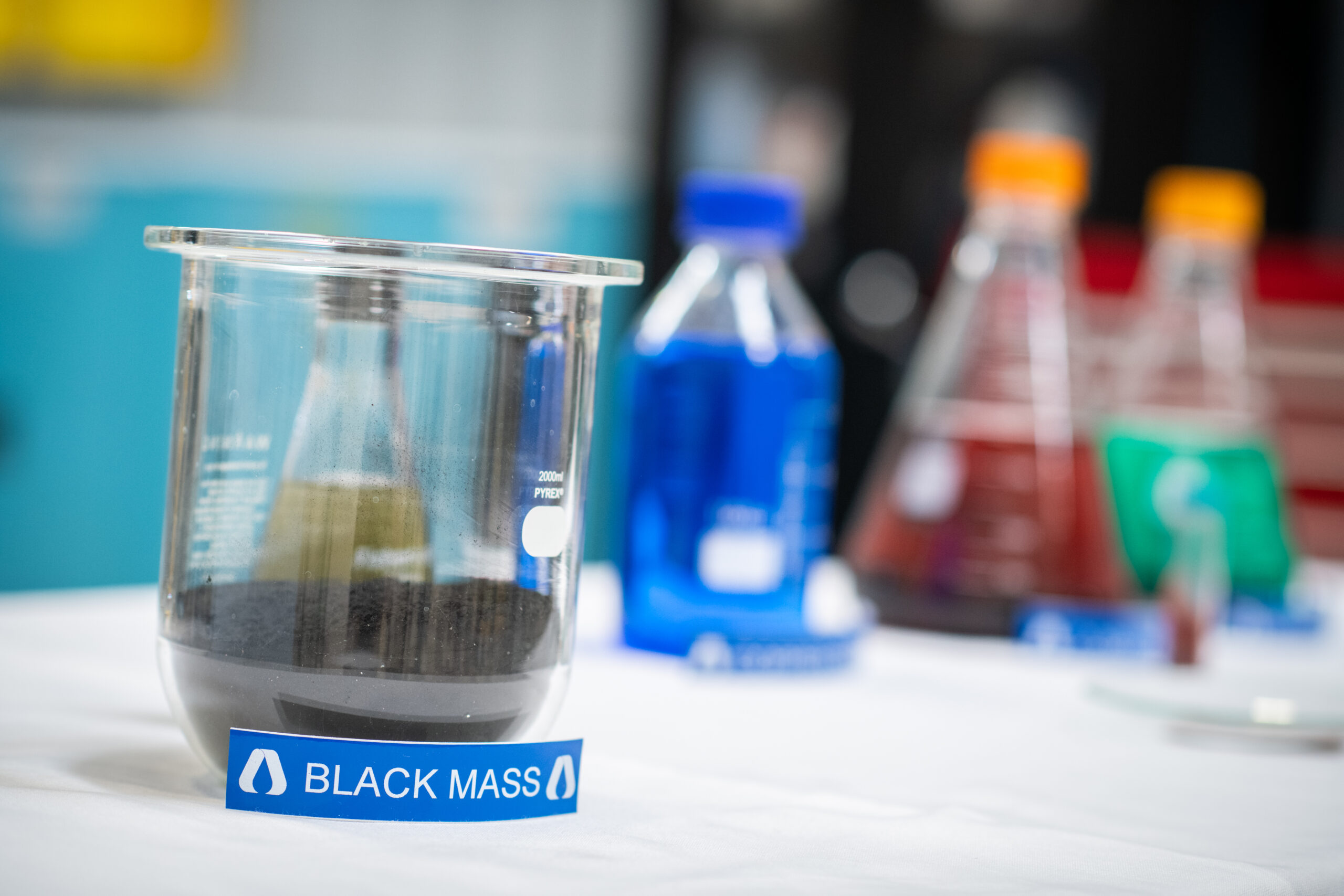 A beaker of 'black mass' ready to be recycled at Aqua Metals' Pilot