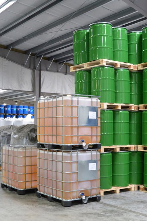 group of workers in the logistics industry work in a warehouse with chemicals Picture of chemical storage and logistics facility